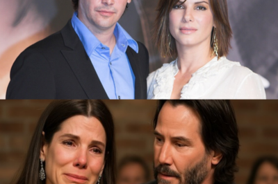Keanu Reeves Stayed Beside Sandra Bullock When Her Past Came Crashing Back 🌑💔—A Truth So Heavy It Shattered Hollywood’s Toughest Masks and Left Even Insiders Weeping in the Shadows — Witnesses swear the moment Sandra’s buried history erupted into the room, Keanu tightened his silent vigil, his eyes dimming as if he alone understood the storm about to swallow her, and when her voice cracked, the tension snapped into a heartbreaking revelation no one was ready to hear 👇